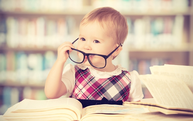 Baby Girl in Glasses Reading